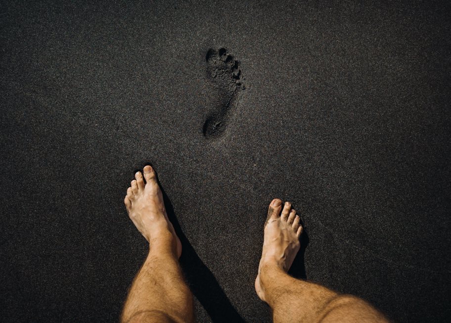 Footprint in black sand